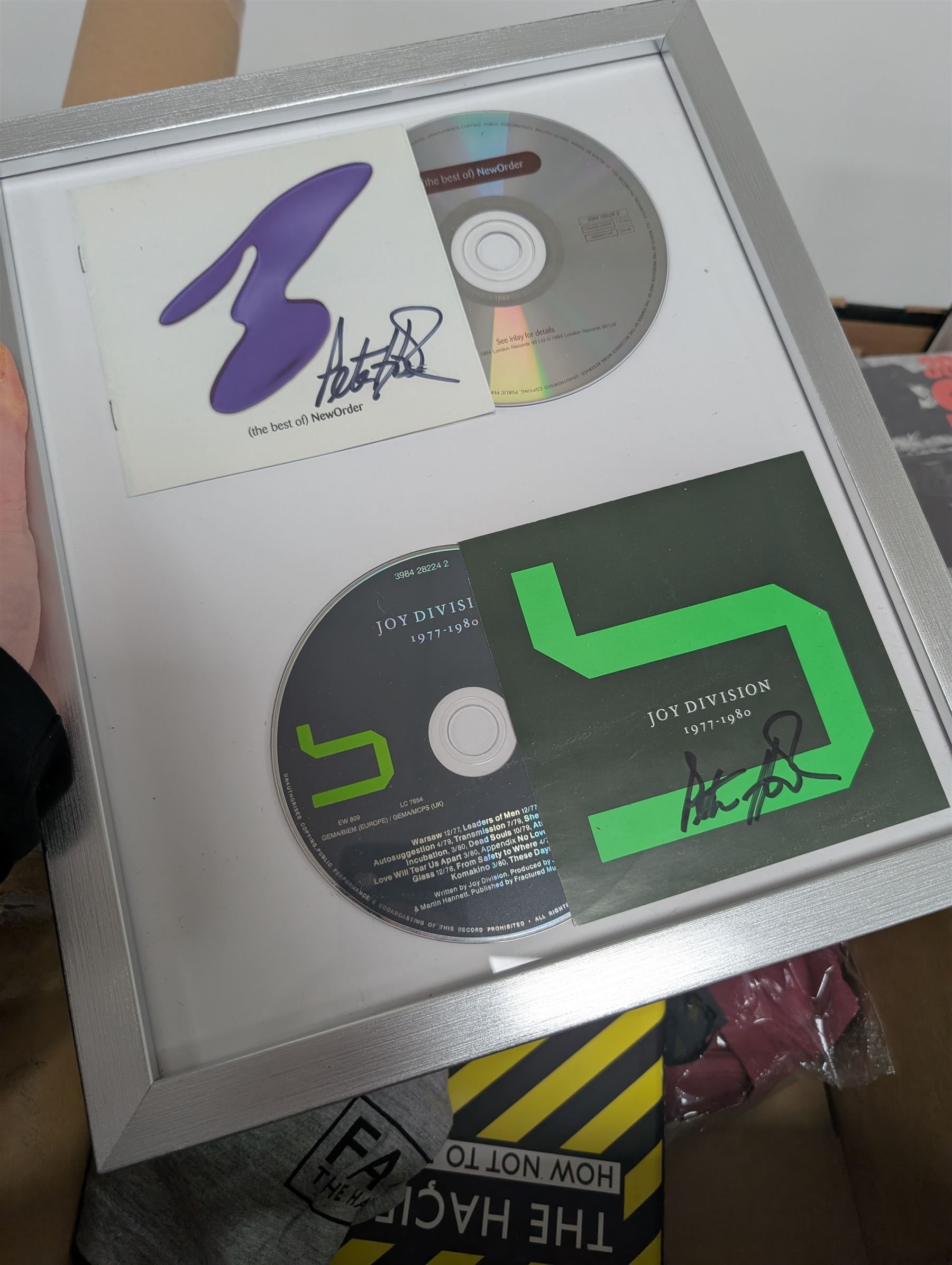 Collection of music memorabilia, including signed Peter Hook memorabilia, Status Quo, Rolling Stones, Neil Diamond, Joy Division tshirts, posters, books, etc