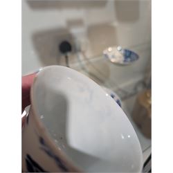 Pair of Chinese blue and white tea bowls, one with cover and four saucers, depicting two figures on a boat at sea, tea bowl H7cm