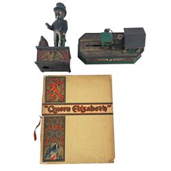  Uncle Sam mechanical money, together with The Monopoly collectors bank and Queen Elizabeth book  