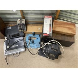 Six shelved cabinets for displaying ‘00’ gauge locomotives comprising plain plywood and white painted examples with track applied to various shelves, largest H63cm, W107cm, D27cm; Collection of tools for building model locomotives to include Weller PU-2D Soldering Pencil and Standard Tip Soldering Iron 20W/230V, Humbrol Modellers Airbrush, Power Supply Units and two wooden chests one of which housing a collection of tools including tweezers, scalping tools, wrenches etc 