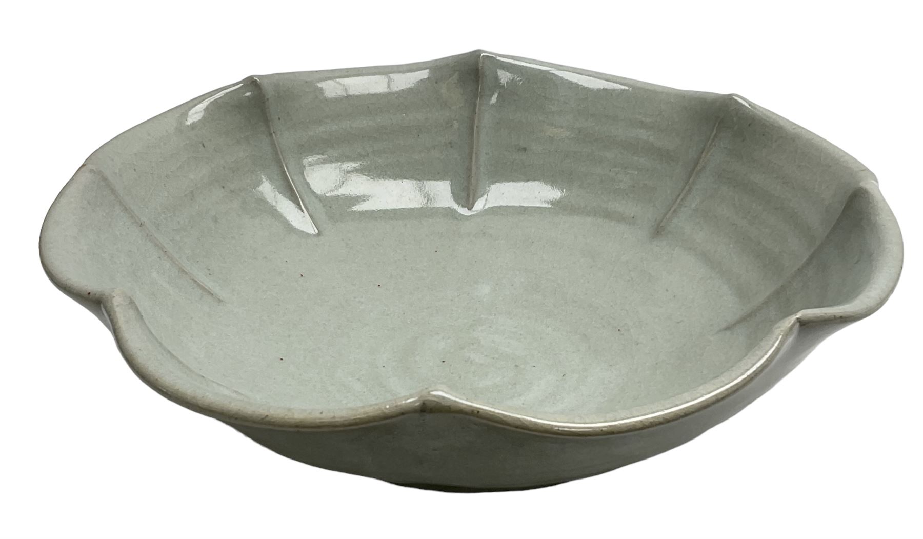 Jeremy Leach (British 1941-): Celadon glazed stoneware bowl of fluted circular form, with impressed mark beneath, D35cm