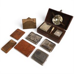 Three cigarette cases, modelled as bank notes, together with a smokers set including ashtr...