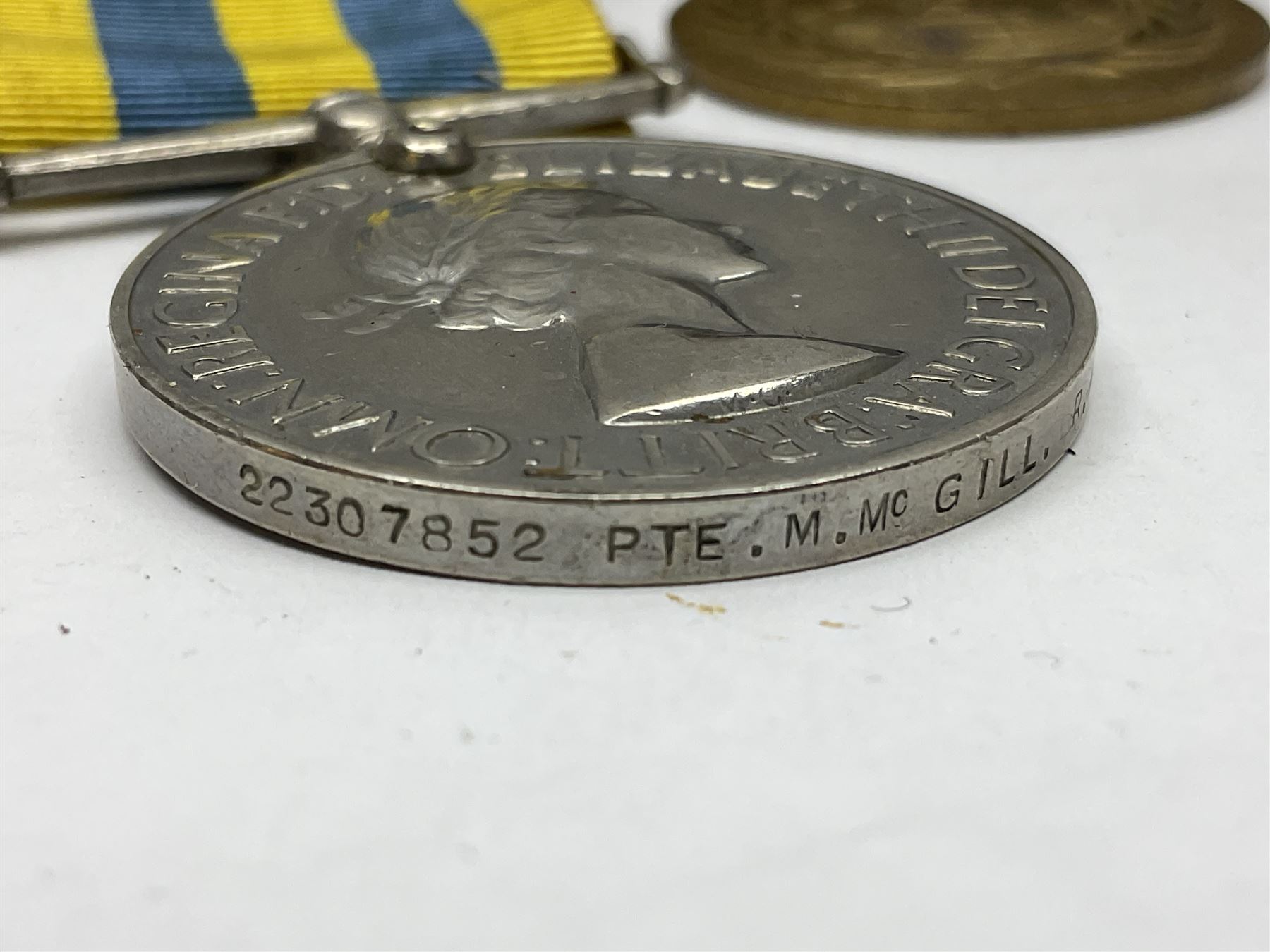 Korean War group of three medals comprising ERII Korea Medal awarded to 22307852 Pte. M. McGill R.A.M.C., UN Korea Medal and ERII General Service Medal with Malaya clasp to 22307852 Cpl. M. McGill R.A.M.C.