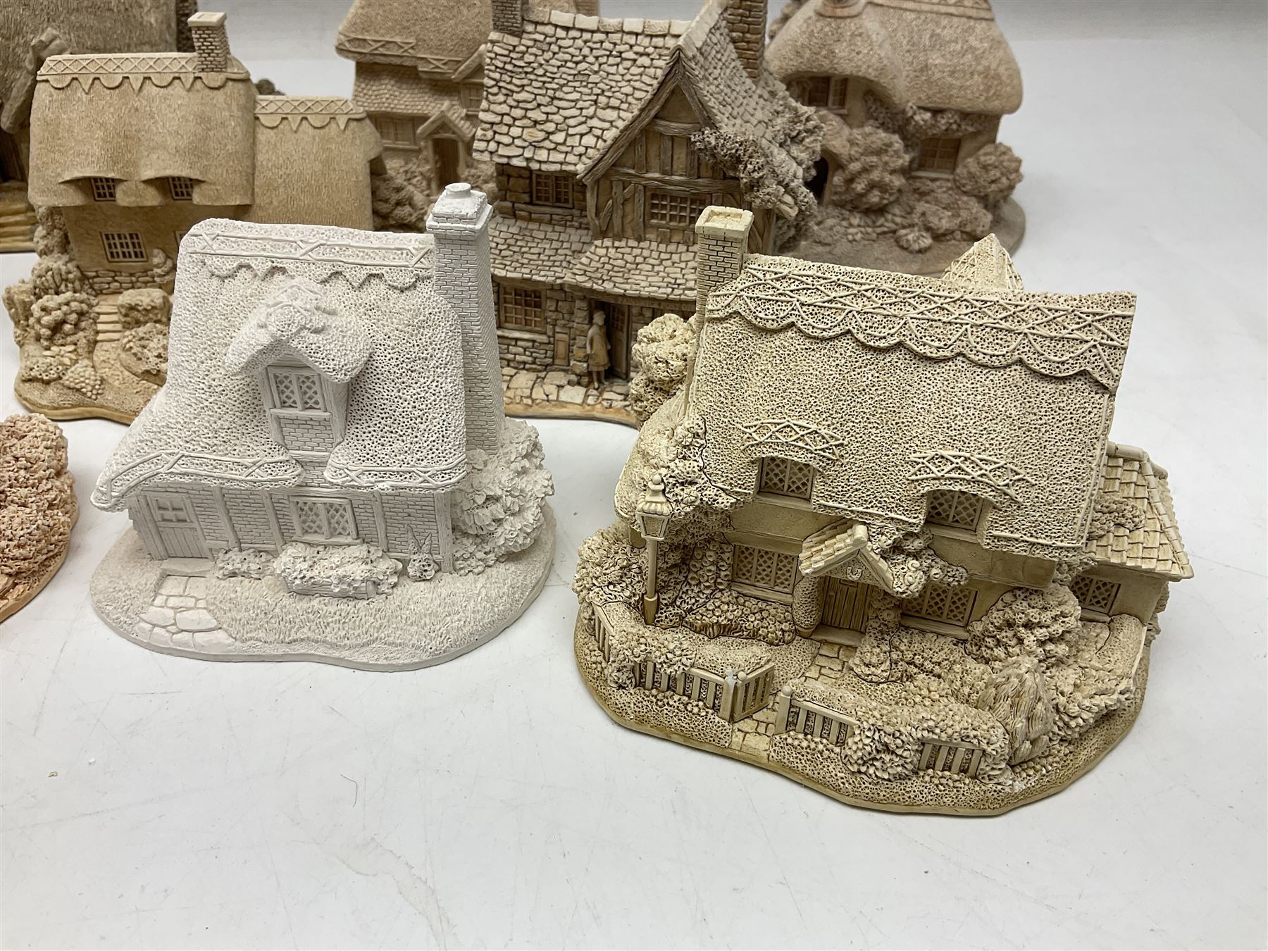 Twenty-three Lilliput Lane models from the Paint Your Own collection, to include Catmint Cottage, Sugar and Spice, Gypsy Cottage, Ruby Cottage and Little Birch, some boxed