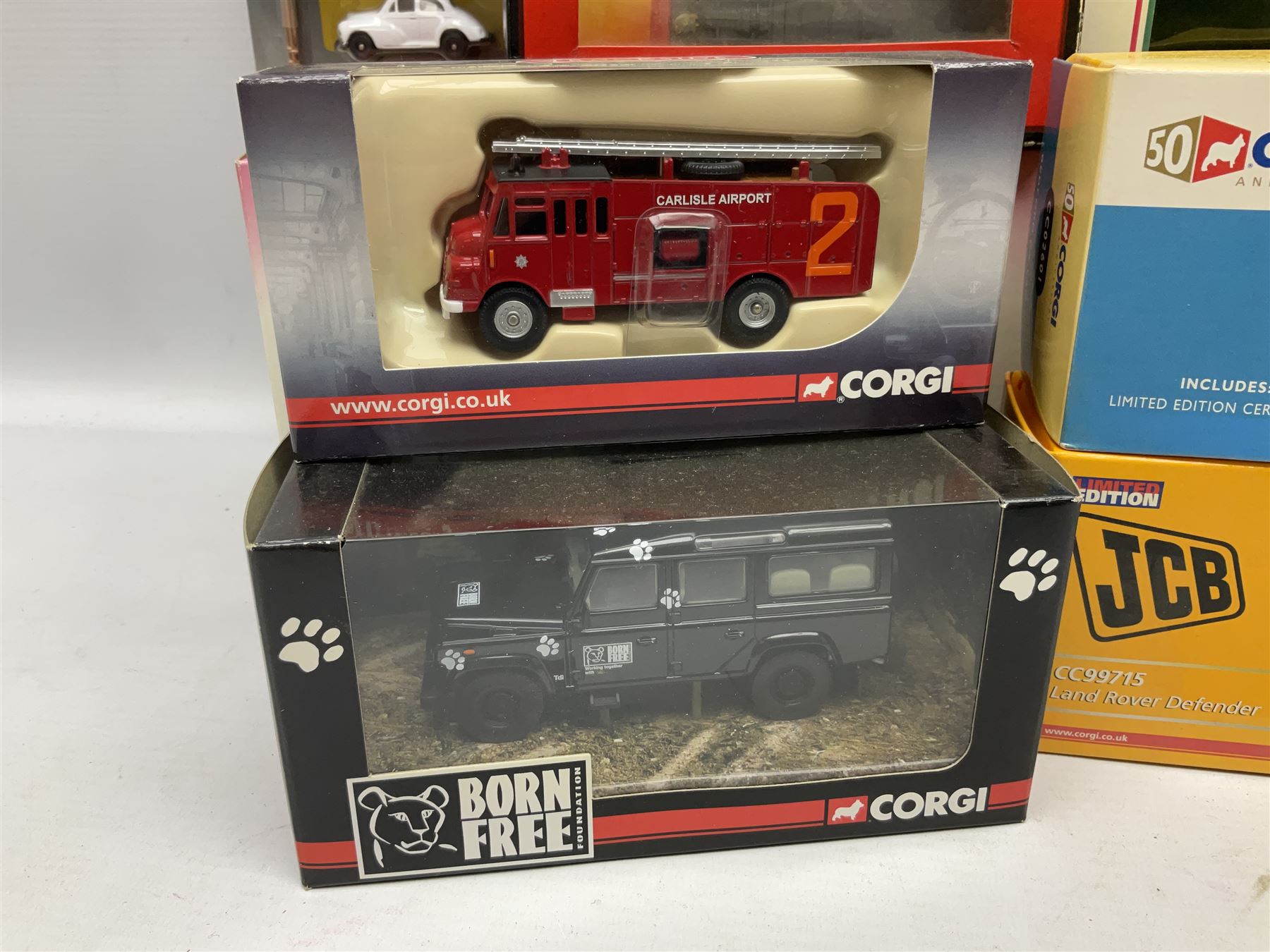 Corgi - eighteen modern die-cast models including racing cars, Land Rovers, Thornycroft Box Van, Ford Transit and Bedford Vans, Minis, Last Routemaster bus, two Trackside DIYCAST sets etc; all boxed (18)