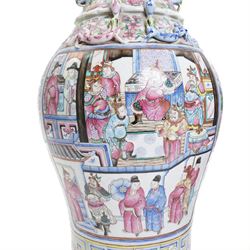 Large pair of 19th century Cantonese famille rose vases, each painted with various courtly scenes, including a display of warriors fighting on horseback before an official and his attendants, double Buddhist lion handles and applied at the shoulders with chilong, the lower band painted with Greek key motif, H58cm (2)