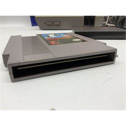Nintendo Entertainment System (1985) console with two controllers, accessories and instruction booklet. NES Games ‘Duck Hunt’ with Nintendo Zapper gun, ‘Pinball’ and ‘Super Mario Bros.’, all with original sleeves and instruction booklets. NES game ‘Super Mario Bros. 2’ cartridge only