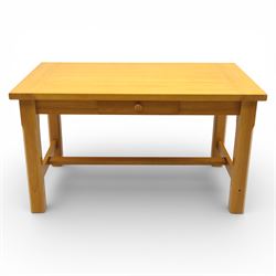 Solid oak dining table and set of seven pine farmhouse chairs including two carvers, rectangular top with tongue and groove style finish, supported a 'H' stretcher with square chamfered legs, pine farmhouse chairs with central splat and turned legs