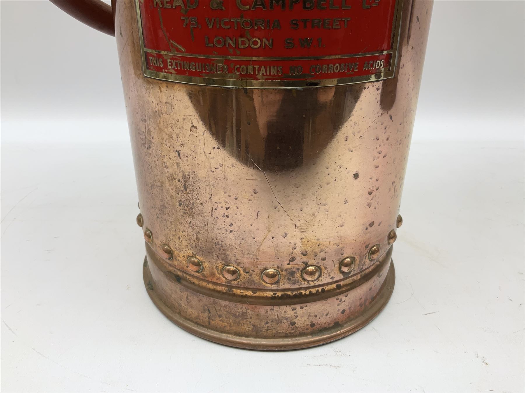 Large copper ‘Waterloo’ fire extinguisher by Read and Campbell Ltd and another Safex example 

