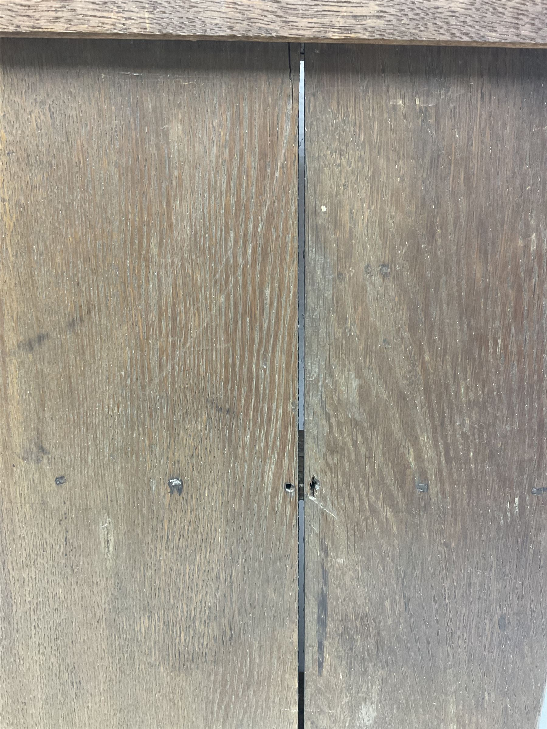 George III oak spoon rack and candle box, the rectangular backplate with shaped  pediment and two six aperture spoon racks, above a candlebox with hinged cover, with various brass spoons and a pair of brass candle snuffers, H56.5cm, W35cm, D14cm 