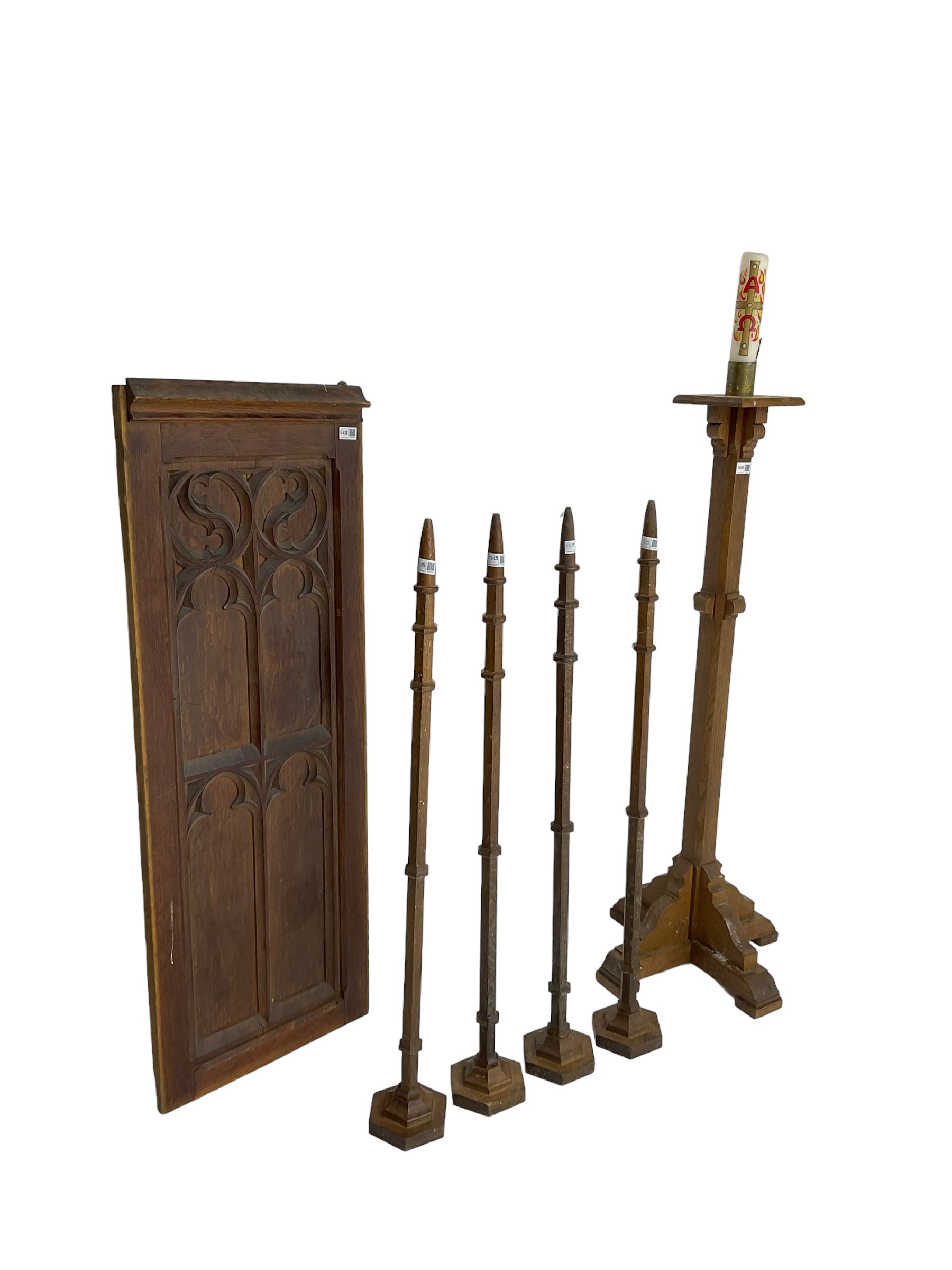 Ecclesiastical oak torchere candle stand; Small panelled oak door with foliate arch applied moulding; set four oak church spokes