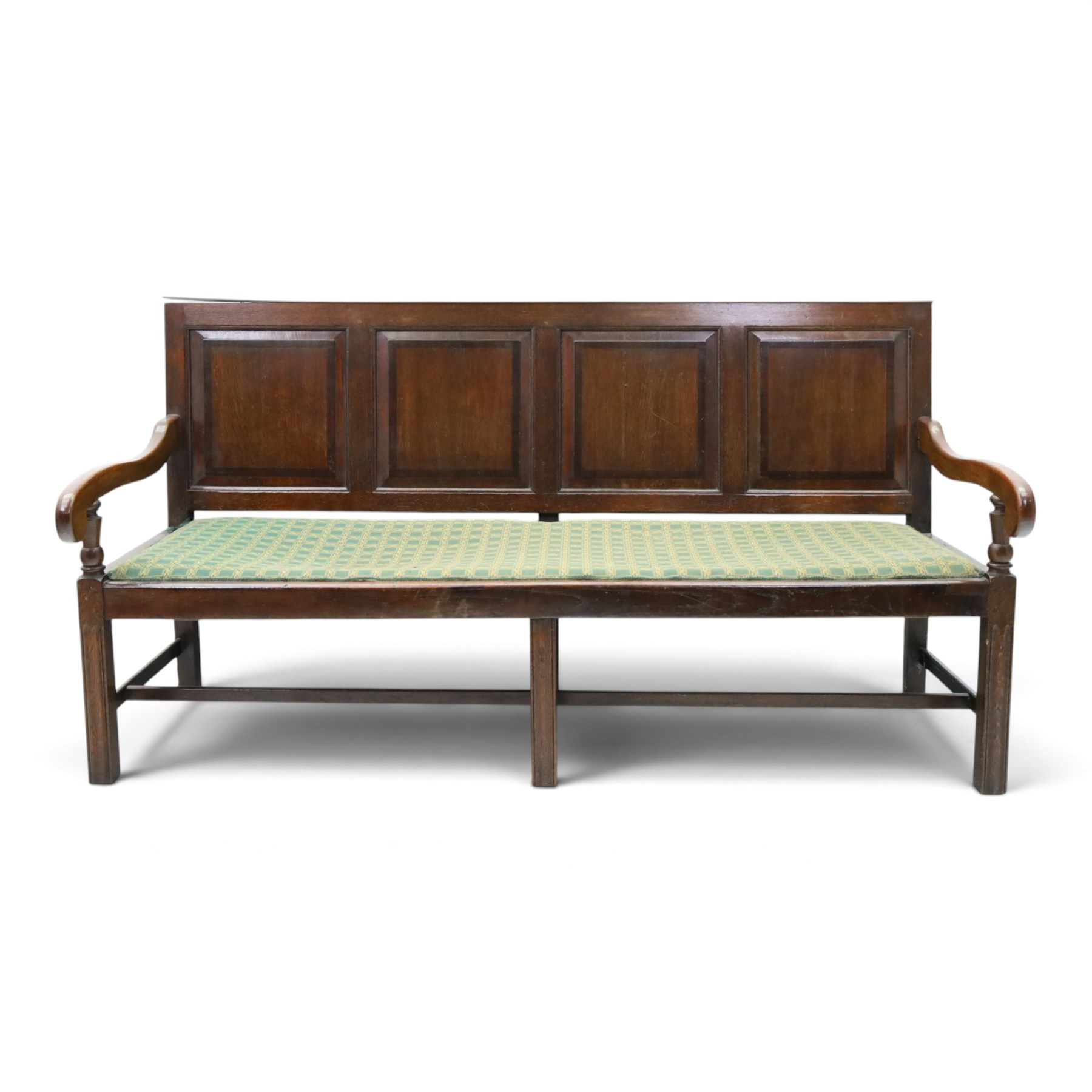 17th century design oak four panelled hall bench, fielded back panels flanked by swept arms on turned supports, raised on six supports united by a stretcher