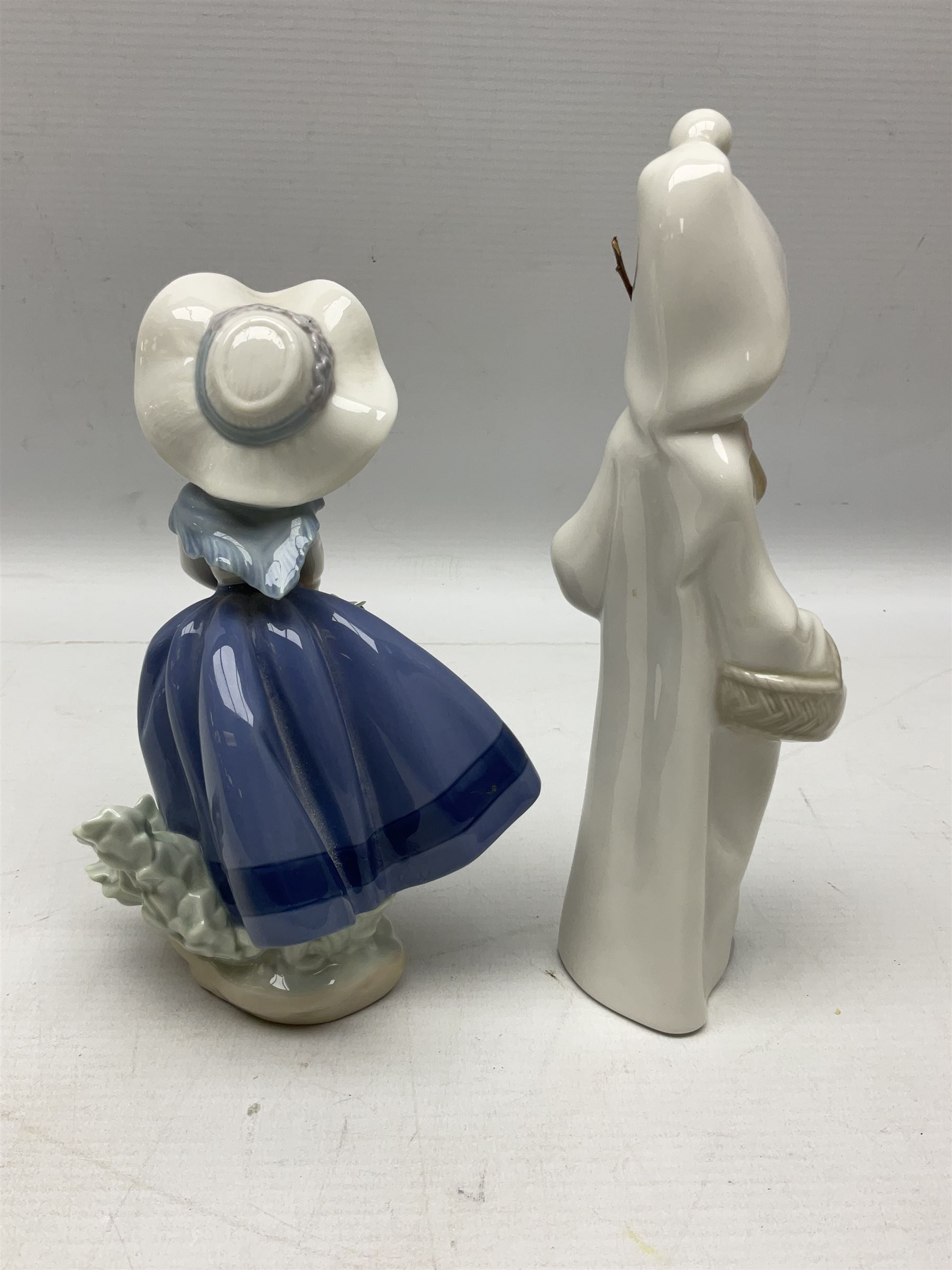Four Lladro figures, comprising Pulling Dolls Carriage no 5044, Belinda with her Doll no 5045, Pretty Pickings no 5222 and Shepherdess with basket no 4678 