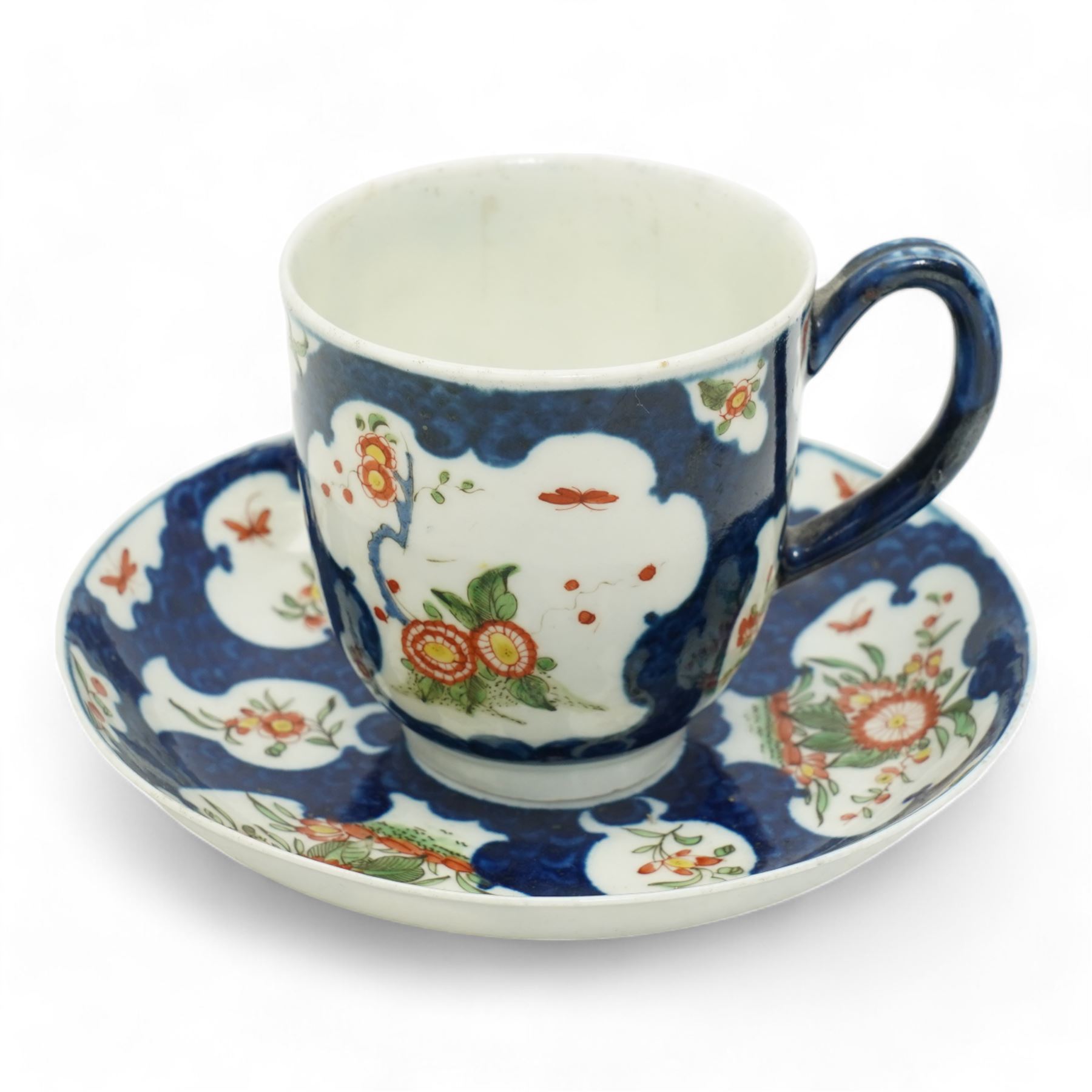 19th century porcelain campana form pot pourri vase, with associated cover, probably Derby, 18th century Worcester scale blue ground kakiemon coffee cup and saucer, c1770, Copeland and Garrett cylindrical vase with flared rim and four scroll supports, H12cm, porcelain chamber stick, modelled as a leaf with grapes flanking the ring handle and a Chinese Export egg cup 