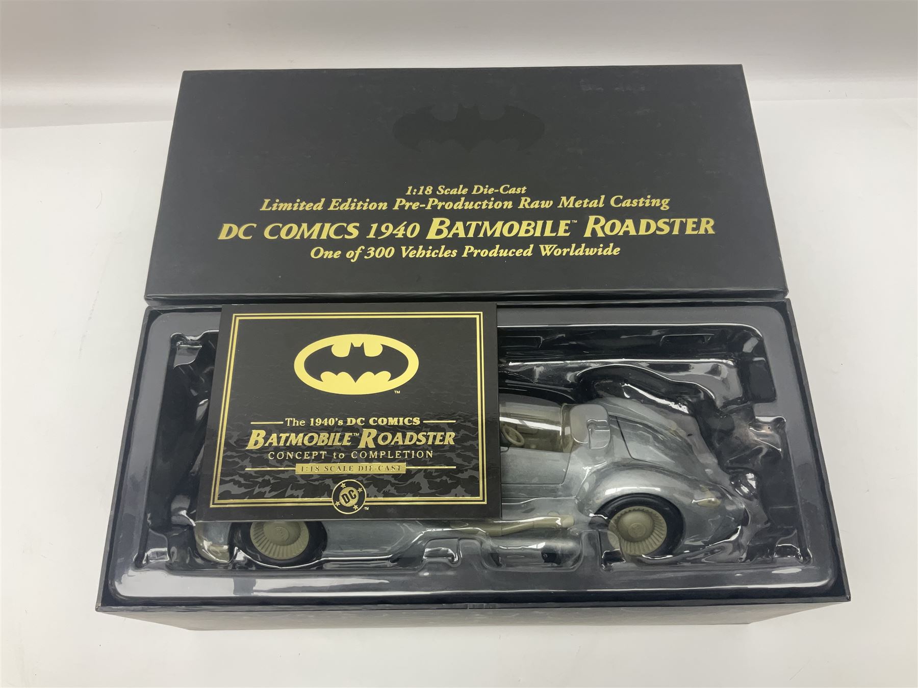 Two Corgi DC Comics die-cast Batmobiles comprising 1:18 scale die-cast Limited Edition Pre-Production Raw Metal Casting 1940 Batmobile Roadster no. 184/300, and 1:24 scale die-cast Limited Edition Raw Metal Casting 1960 Batmobile no. 858/1000, both with original boxes and certificates of authenticity 