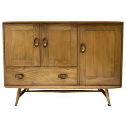 Ercol - mid-20th century light elm 'Windsor (366)' sideboard, fitted with a double cupboard over single drawer, the right-hand cupboard with a cutlery drawer to top over single shelf, on splayed tapering supports