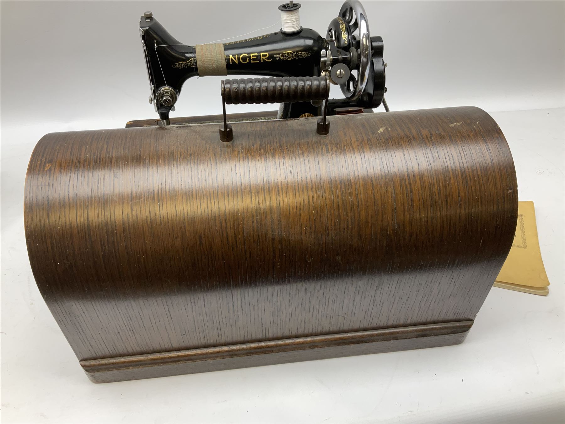 Singer sewing machine no. EA584046 in case (missing key) and Singer Manual of Family Sewing Machines