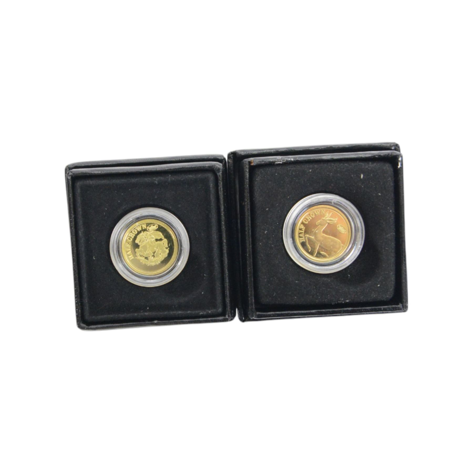 Two The London Mint Office 2009 9ct gold 1 gram half crown coins, Queen Elizabeth II Tristan Da Cunha 2014 'The World War One Centenary Silver Crown Set', The Royal Mint 2008 one ounce fine silver Britannia, United Kingdom 1986 brilliant uncirculated coin collection and other coins