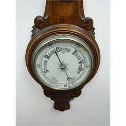  Edwardian carved oak aneroid barometer and thermometer, H89cm  