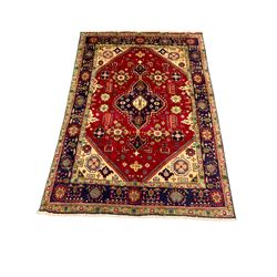 Qashqai red and blue ground rug, with central medallion, green repeating border with geometric motifs 