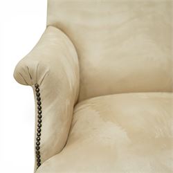 Sofas & Stuff - pair of ‘Thistle’ armchairs upholstered in neutral fabric, each with gently sloping back, padded scroll arms with close-set stud detailing, loose seat cushions, raised on turned wooden legs with brass castors