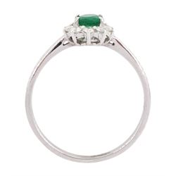 18ct white gold oval cut emerald and round brilliant cut diamond cluster ring, stamped 750