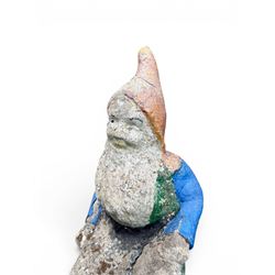Early large scale composite stone garden gnome, original distressed paint