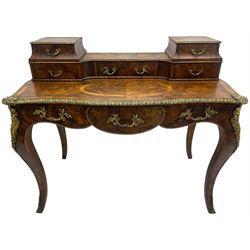 Late 19th to early 20th century French figured walnut writing desk, raised back fitted with drawers, shaped top with Kingwood banding and foliage cast edge moulding, fitted with single drawer, on cabriole supports mounted by shell and flower head cartouches 