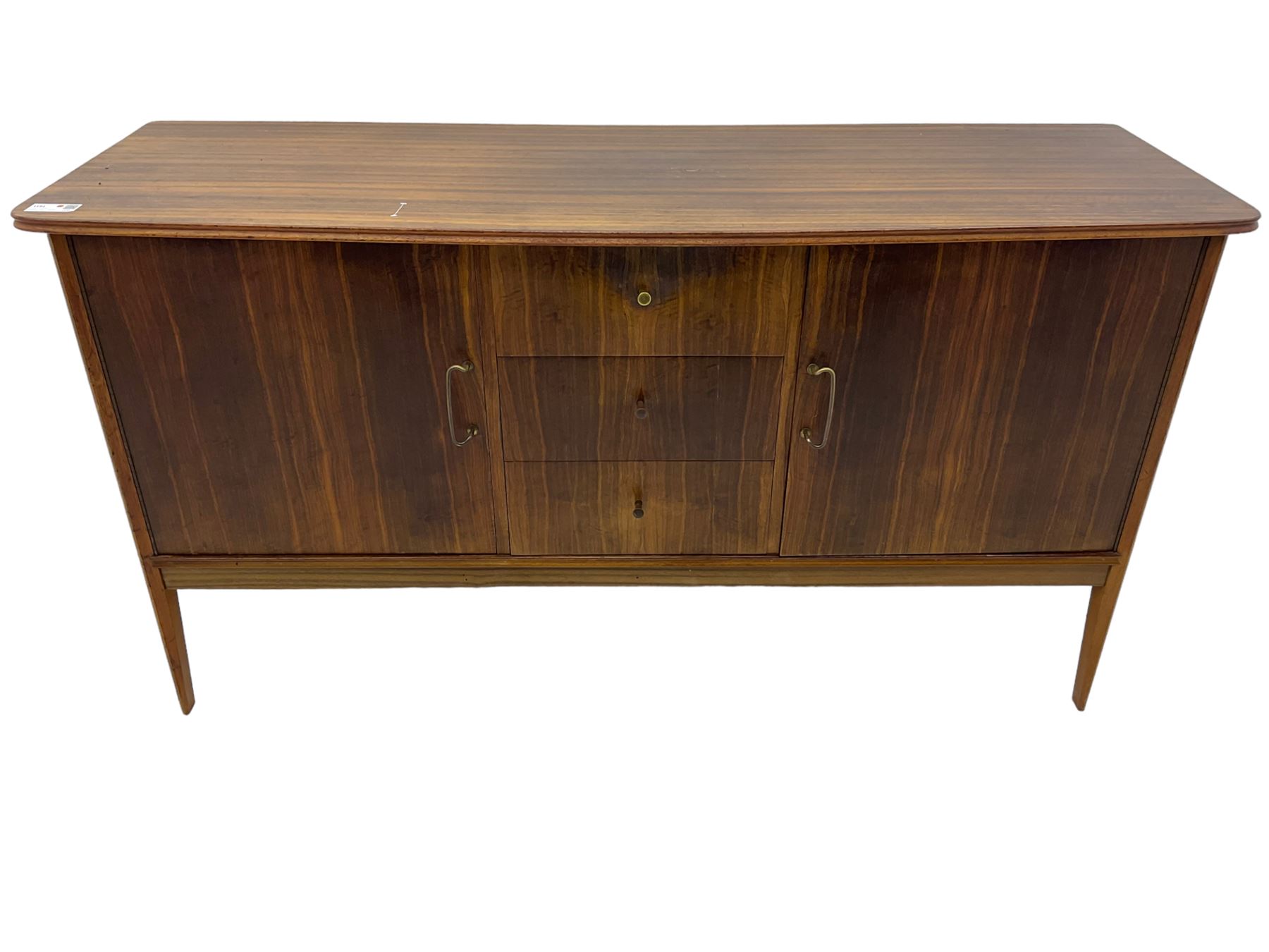 Peter Hayward for Vanson - mid-20th century teak sideboard, rectangular top with rounded corners over three central drawers, flanked by two cupboard doors enclosing shelves, raised on tapered supports