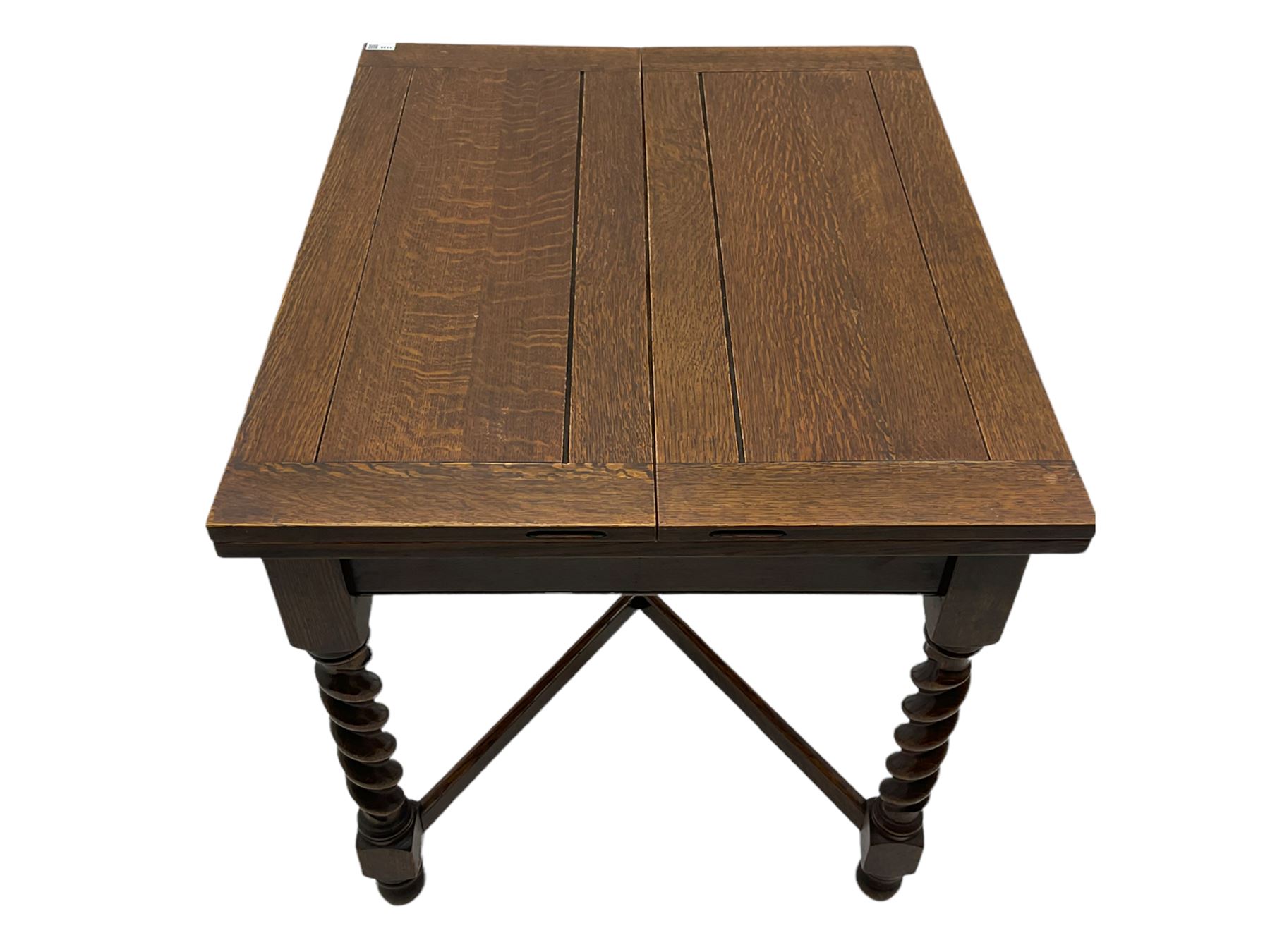 Early 20th century oak barley twist extending table, two fold-over leaves with pull-out stays, spiral turned supports joined by x-stretchers