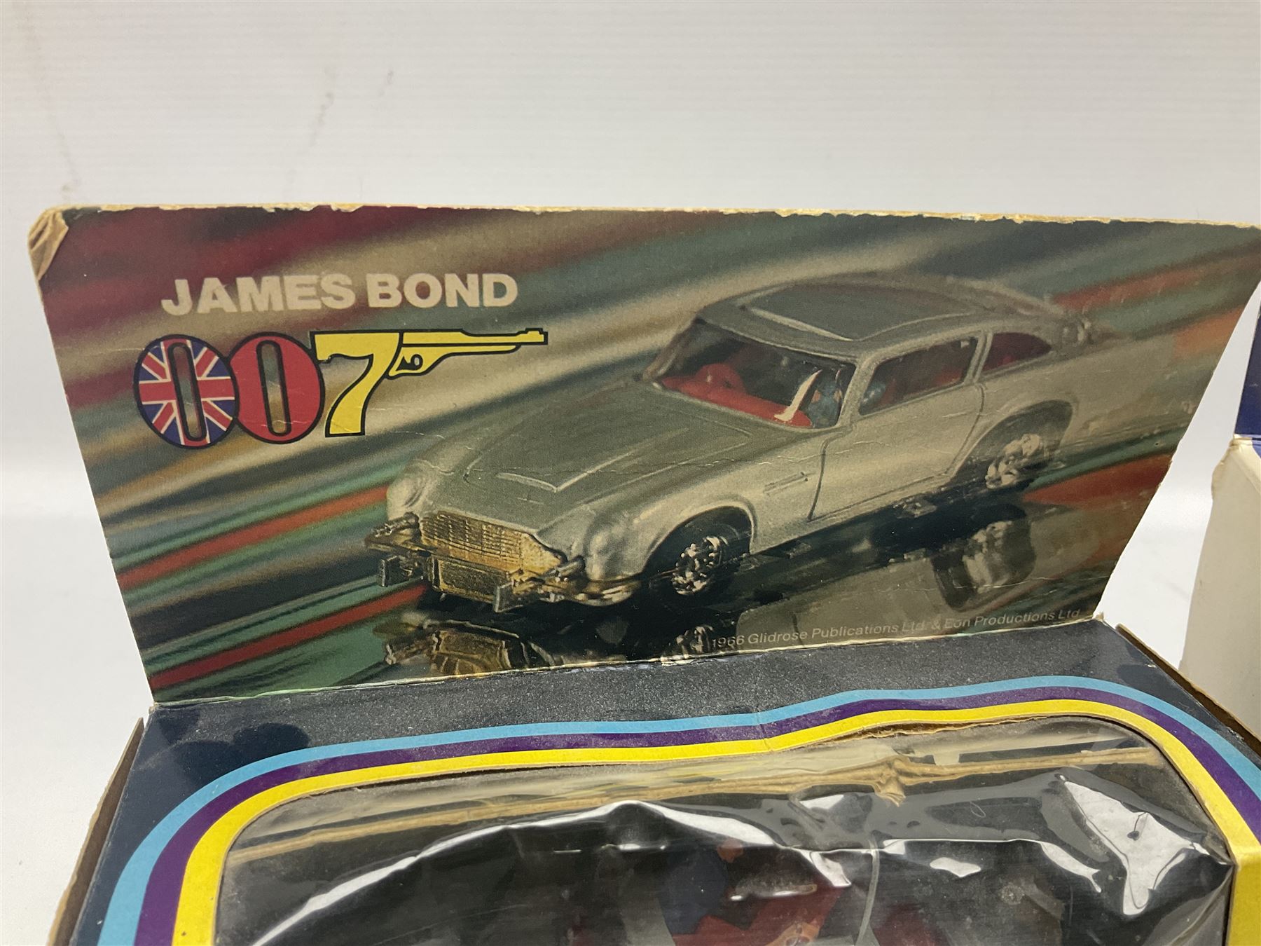 Corgi - die-cast model of James Bond Aston Martin DB5 No.271 with silver body and red interior, gold bumpers and four-spoke wheels, James Bond and two bandit figures; original window box with header card; and Dinky Shado 2 Mobile with one missile No.353; in window box (2)