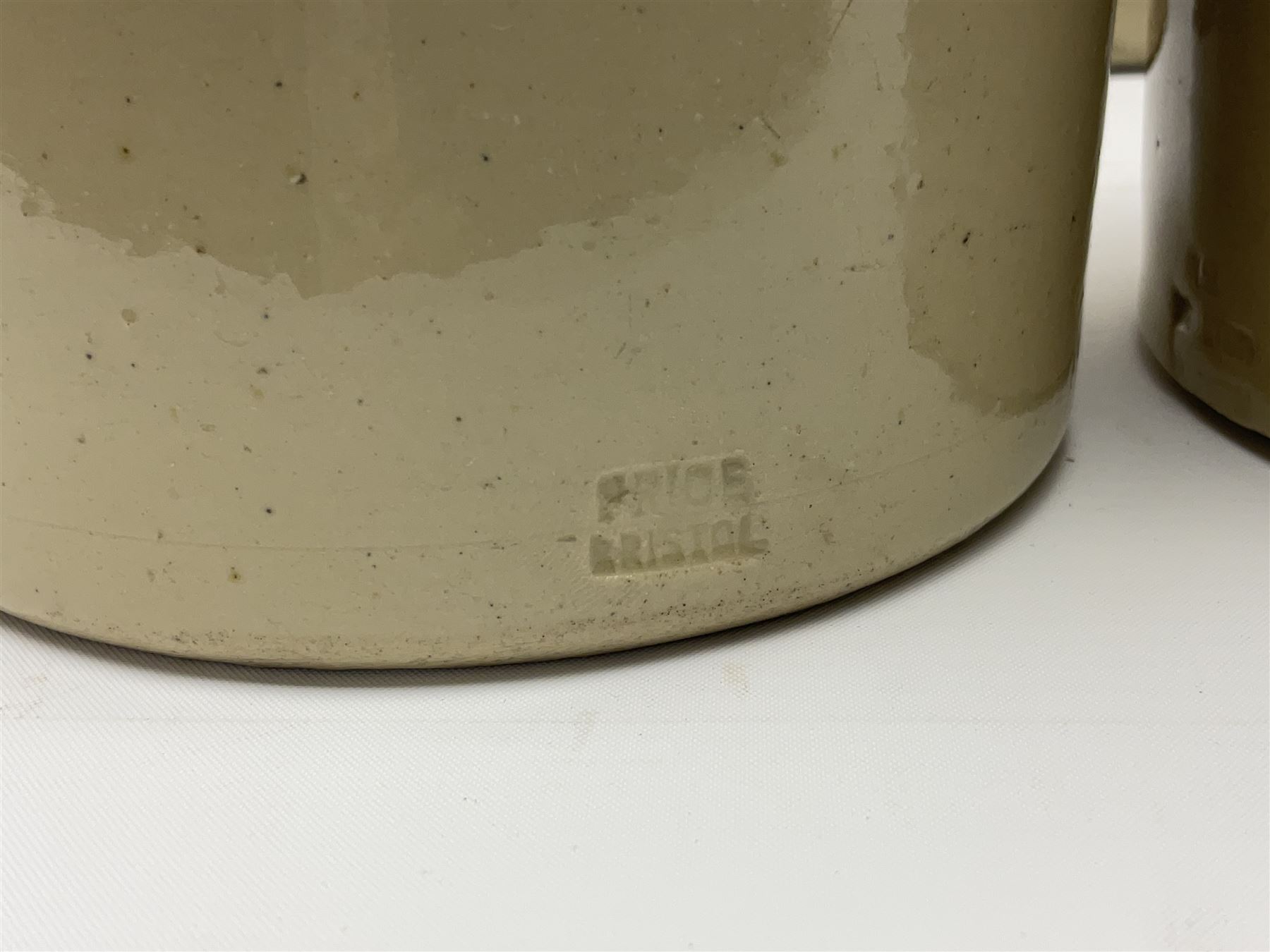 Large 2 gallon stoneware flagon, stamped 'John Soulby Wine Merchant Malton 2 Gall', together with a collection of similar stoneware jars and bottles, largest H40.5cm