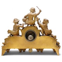 French-late 19th century gilt and spelter mantle clock, highly decorative case with two Sevres style porcelain panels to the front and surmounted with three figures of children playing musical instruments, white enamel dial with Roman numerals and steel moon hands, two train countwheel strike movement, striking the hours and half hours on a bell. With key and pendulum.    
