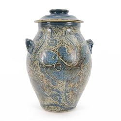 John Egerton (c1945-): studio pottery stoneware vase and cover, decorated with fish and ammonites upon a blue ground, H38cm