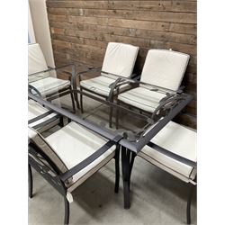 Metal framed garden table with glazed top (W170cm, D102cm, H71cm) and six armchairs with cushions 
