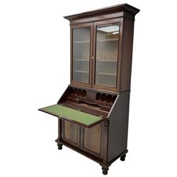 Early 19th century figured mahogany bureau bookcase, projecting splay moulded cornice over three adjustable shelves enclosed by two glazed doors, fall front revealing pigeonholes, cupboard and drawers, pull-out strays with scroll carved terminals, double cupboard with two panelled doors, on turned feet 