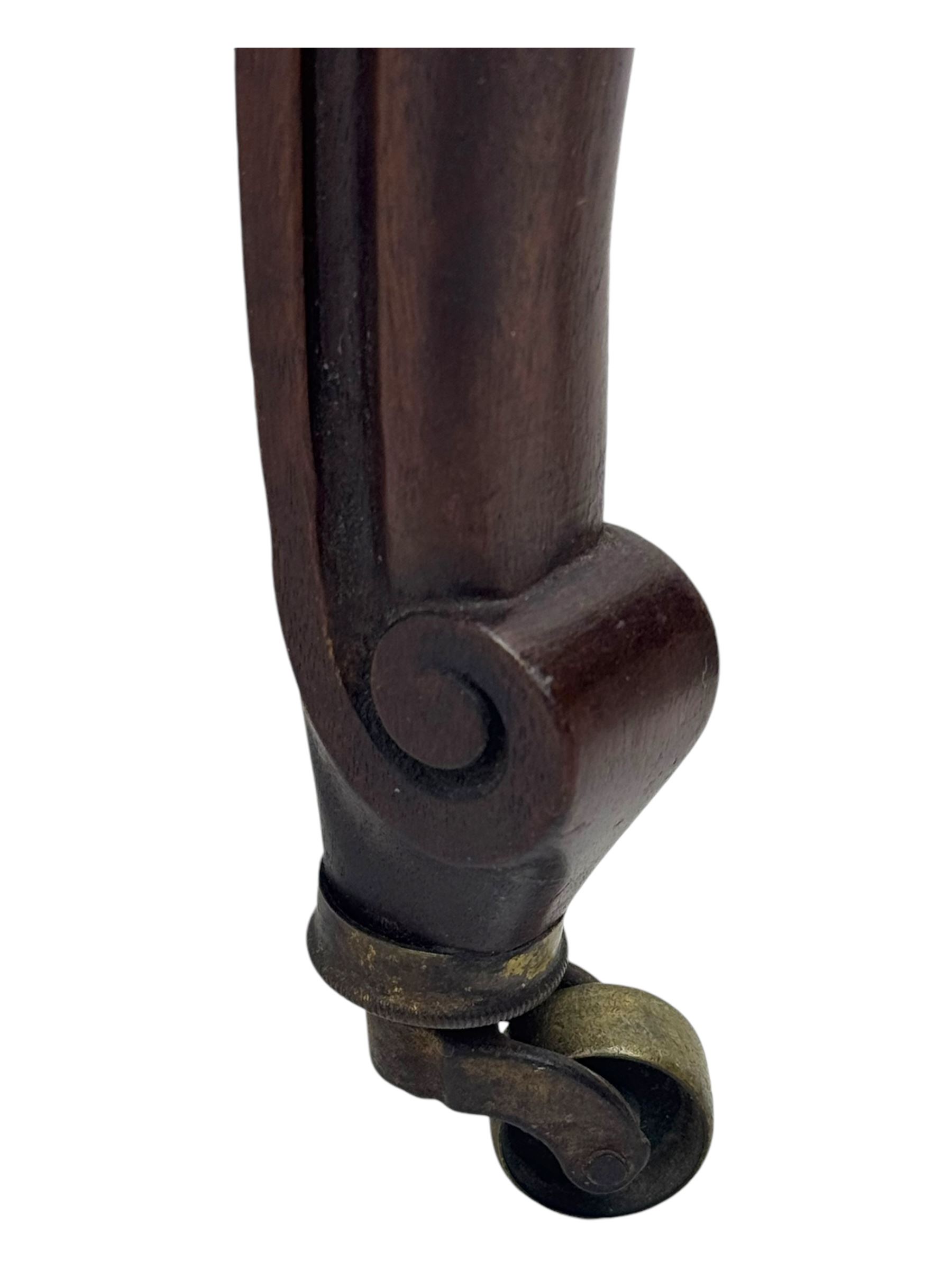 Pair of Edwardian inlaid rosewood salon chairs, upholstered in dusky pink fabric with gimp trim, oval backrest with carved crest rail with central shell motif and pierced splat, on cabriole supports terminating in castors