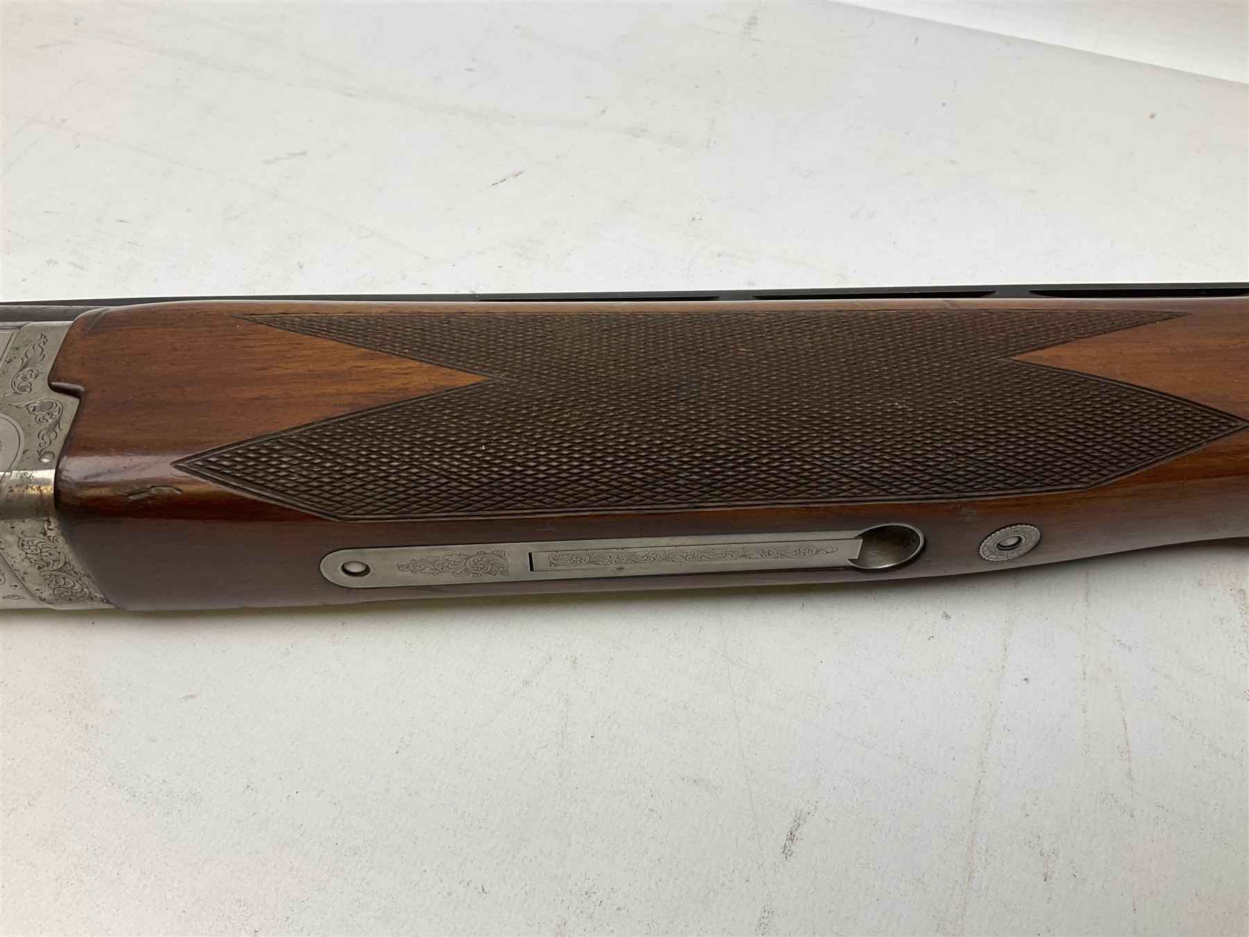 Winchester Japan 5500 12-bore by two-and-three quarters over-and-under double barrel boxlock ejector sporting gun, with 71cm barrels, ventilated rib and barrels, the walnut stock with chequered pistol grip and fore-end, single selective trigger and top safety, serial no.K542927E, L115cm overall; in gun sling SHOTGUN CERTIFICATE REQUIRED