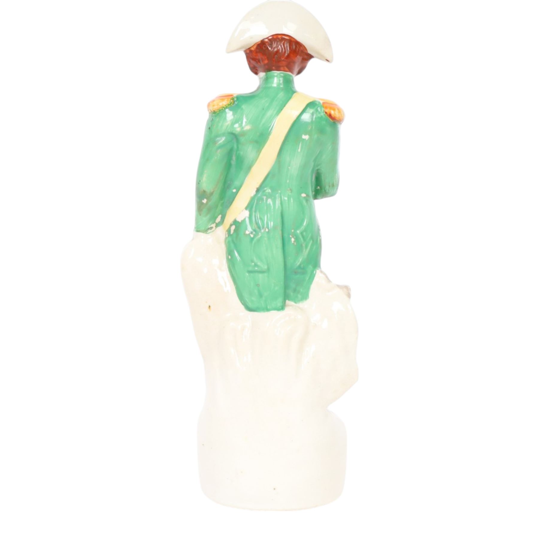 Rare mid 19th century Staffordshire pottery figure of Admiral Lord Nelson, modelled standing in uniform with green tunic, beside anchor, H27cm