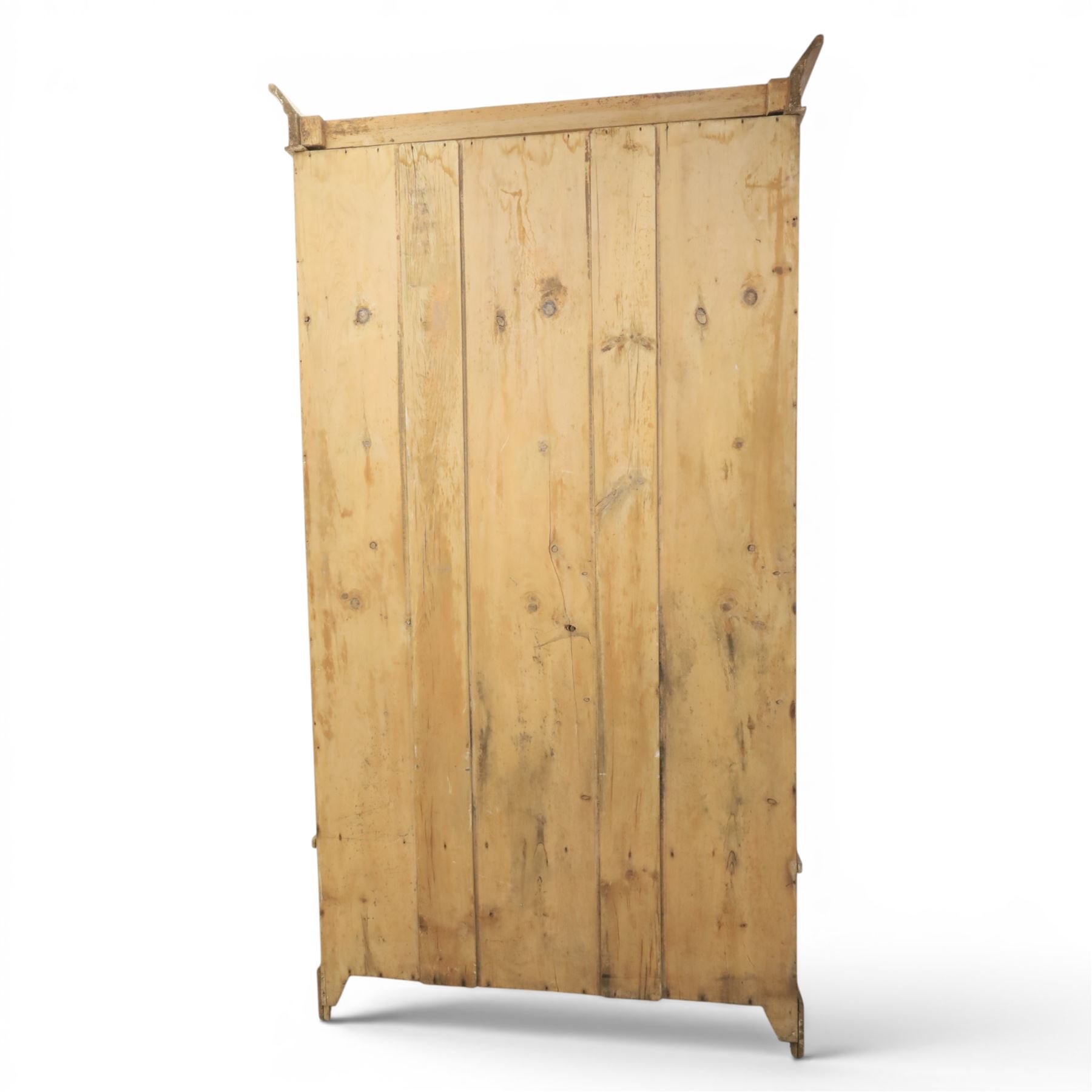 Traditional waxed pine single wardrobe, featuring single panelled door above base drawer, loop handles