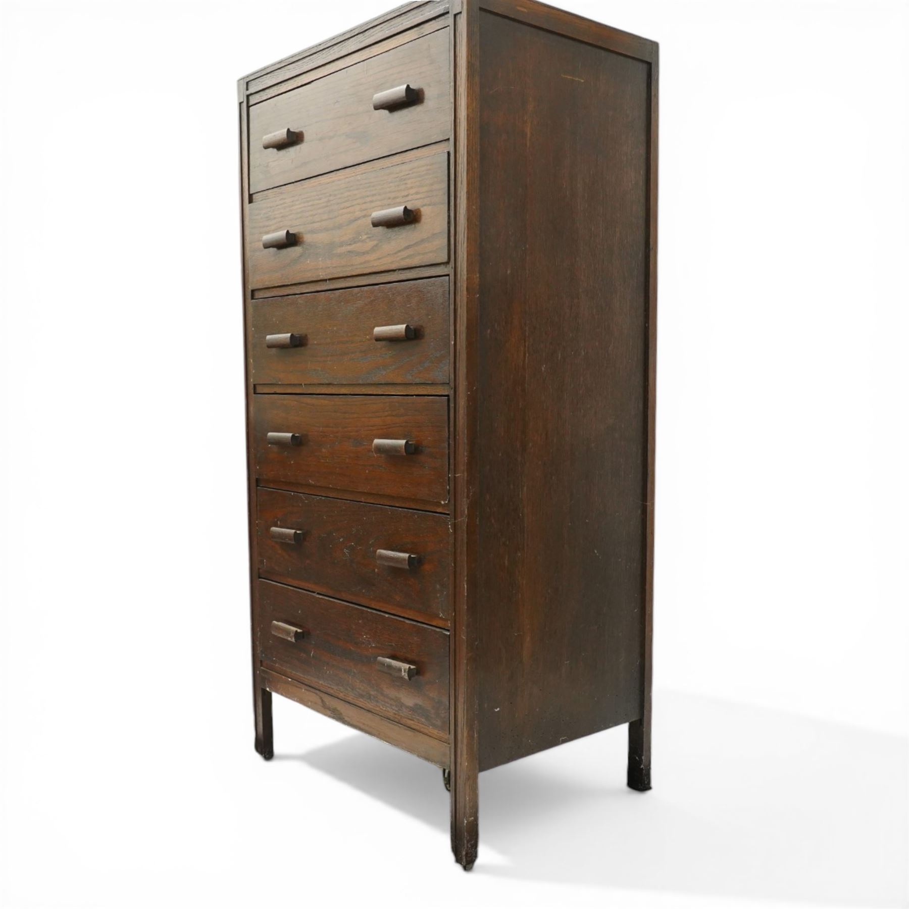 Edwardian tall oak chest fitted with six long drawers, on stile supports