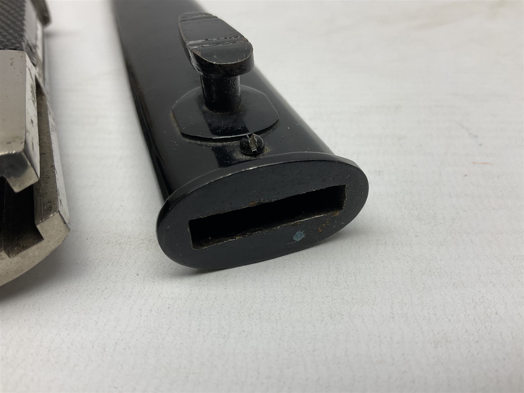 German Wehrmacht KS98 dress bayonet, with plain 19.5cm fullered blade marked Anton Wingenje Solingen, chequered black plastic grip and original leather washer to ricasso; in black painted metal scabbard L36cm overall