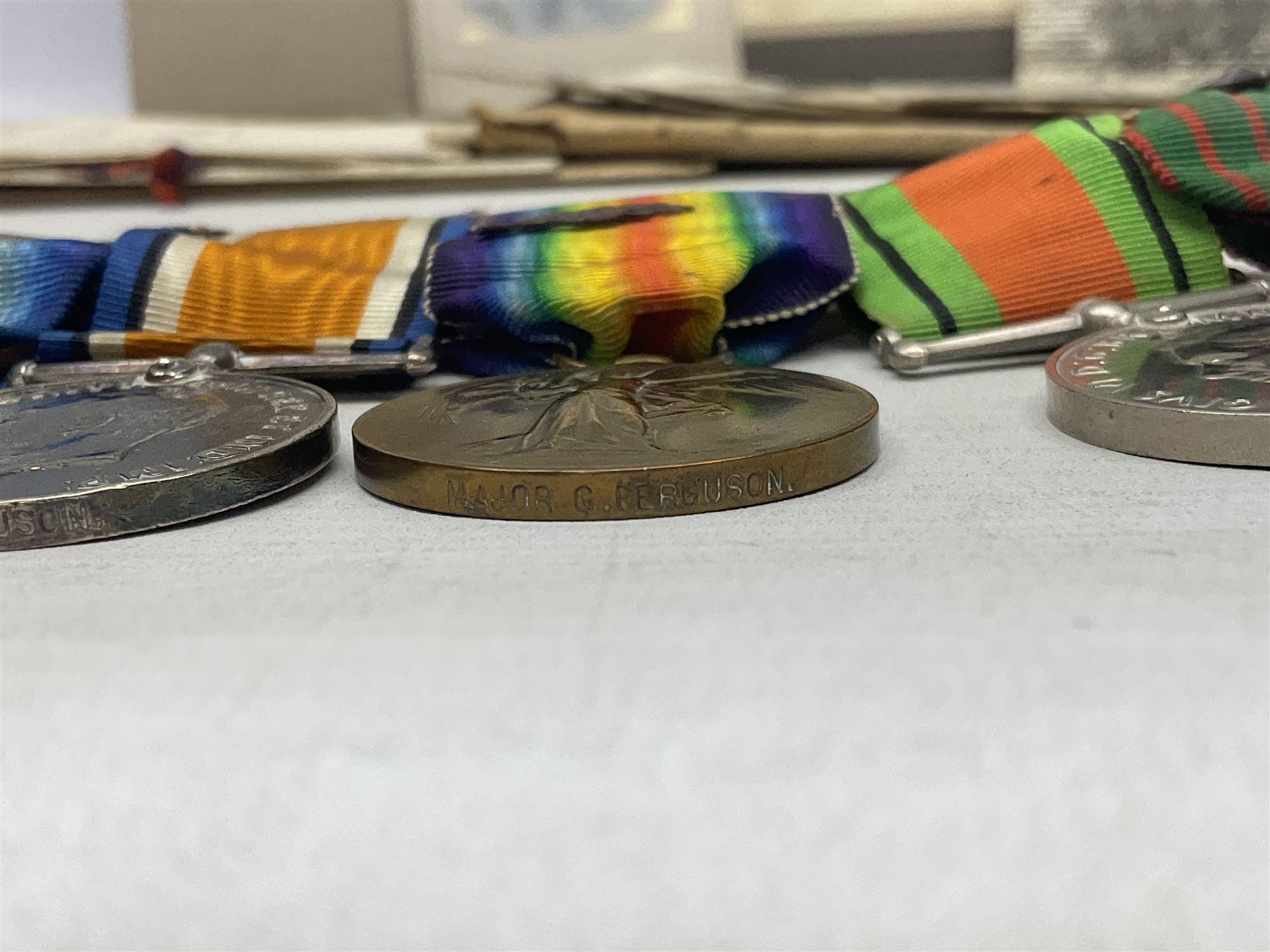 WW1/WW2 Military Cross group of five medals comprising M.C., 1914 Star with date clasp to 34156 Sjt. G. Ferguson R.F.A., British War Medal and Victory Medal with MID leaves to Major G. Ferguson, WW1 French Croix De Guerre with MID Star and WW2 Defence Medal; all with ribbons on pinned wearing bar; WW1 group of five miniature dress medals; two Royal West Kent cap badges; early 20th century silver cigarette case engraved with GF monogram and adapted as a photograph holder with image of Ferguson in civilian clothing; presentation Rotary 9ct gold cased wrist-watch with 1931 British Legion inscription verso; and archive of ephemera including 1914 MID certificate; WW2 Home Guard certificate; over twenty career spanning photographs of Regimental groups, portraits, Sandhurst etc; 1914 Commission document to 2nd Lieutenant; 11th Brigade R.F.A. Roll of Honour 1914-18; 'Soldier's Small Book'; Army Book 439 etc