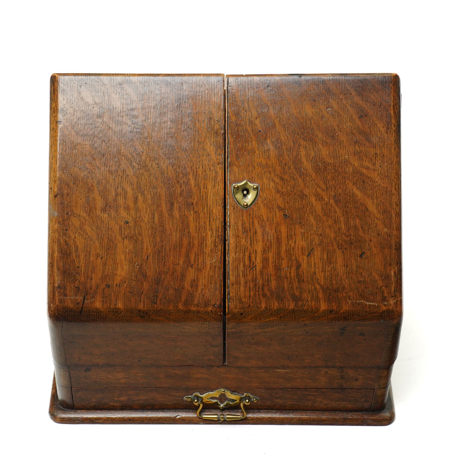 Victorian oak stationery cabinet, the two-door front opening to reveal compartmentalised interior, single drawer to base, H27cm W31cm 