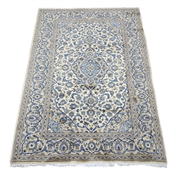  Persian Kashan ivory ground rug, blue scrolled foliage field with medallion, repeating guarded border, 303cm x 194cm  