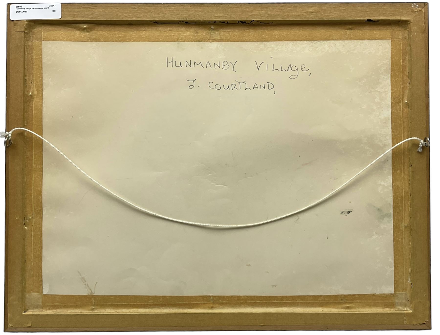 J Courtland (British 20th century): 'Hunmanby Village' near Filey, oil on canvas board signed, titled verso 30cm x 40cm