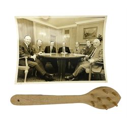 Early 1970s sepia photograph of the Pools Panel meeting at The Waldorf Hotel, London including Raich Carter, Marquis of Bath, Arthur Ellis, Neil Franklin etc 19 x 25cm; together with a beech spaghetti server with manuscript presentation inscription 'To Raich Carter from Henry 6th Marquis of Bath 1974'; Provenance: By direct descent from the family of Raich Carter having been consigned by his daughter Jane Carter (2)