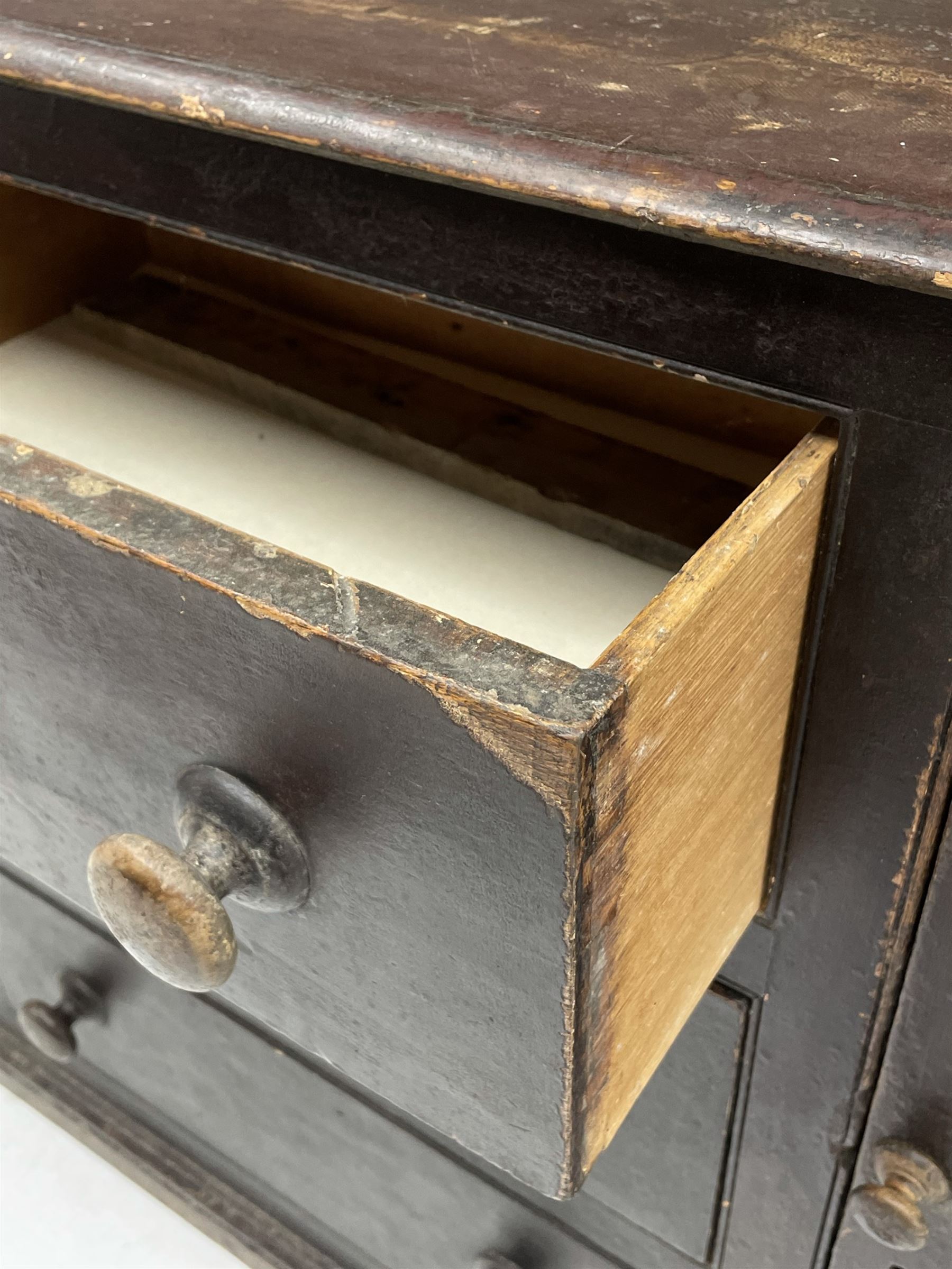 Early 19th century scumbled pine dresser, the projecting cornice over two heights plate rack with moulded frame, the base with reeded canted corners fitted with three drawers and two panelled cupboards, panelled sides, moulded skirt base