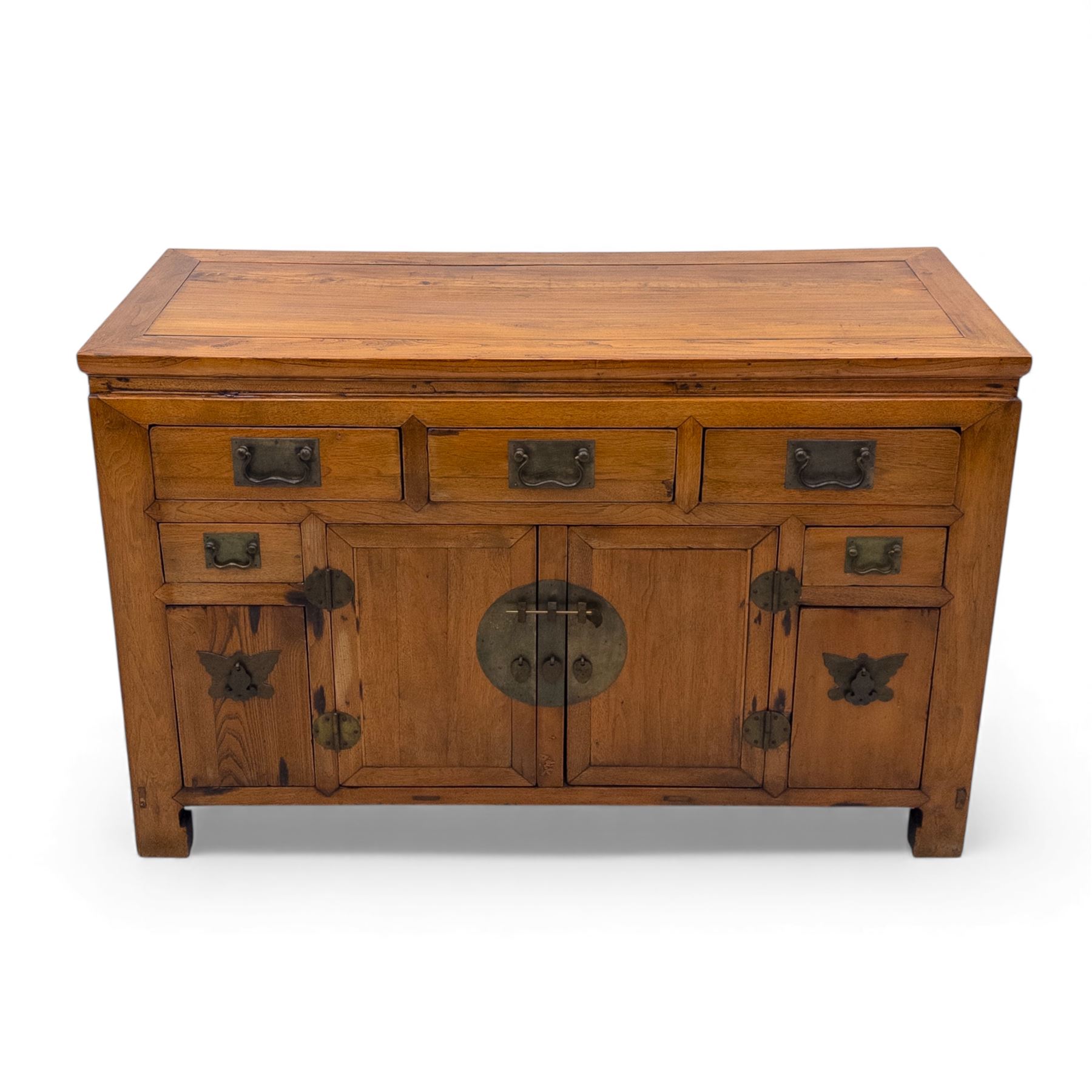 Late 20th-century Thai elm sideboard fitted with an arrangement of three drawers over a central cupboard flanked by a further two drawers, raised on square post feet 