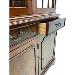 Georgian style mahogany bookcase on cupboard, dentil cornice over three glazed doors enclosing shelves, the lower section fitted with three drawers and three cupboards, on bracket feet